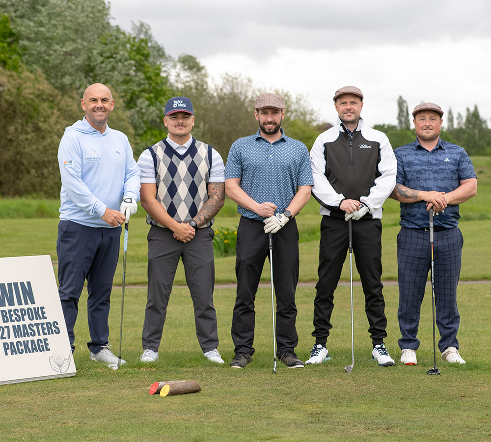 Golfers lined up on the golf course