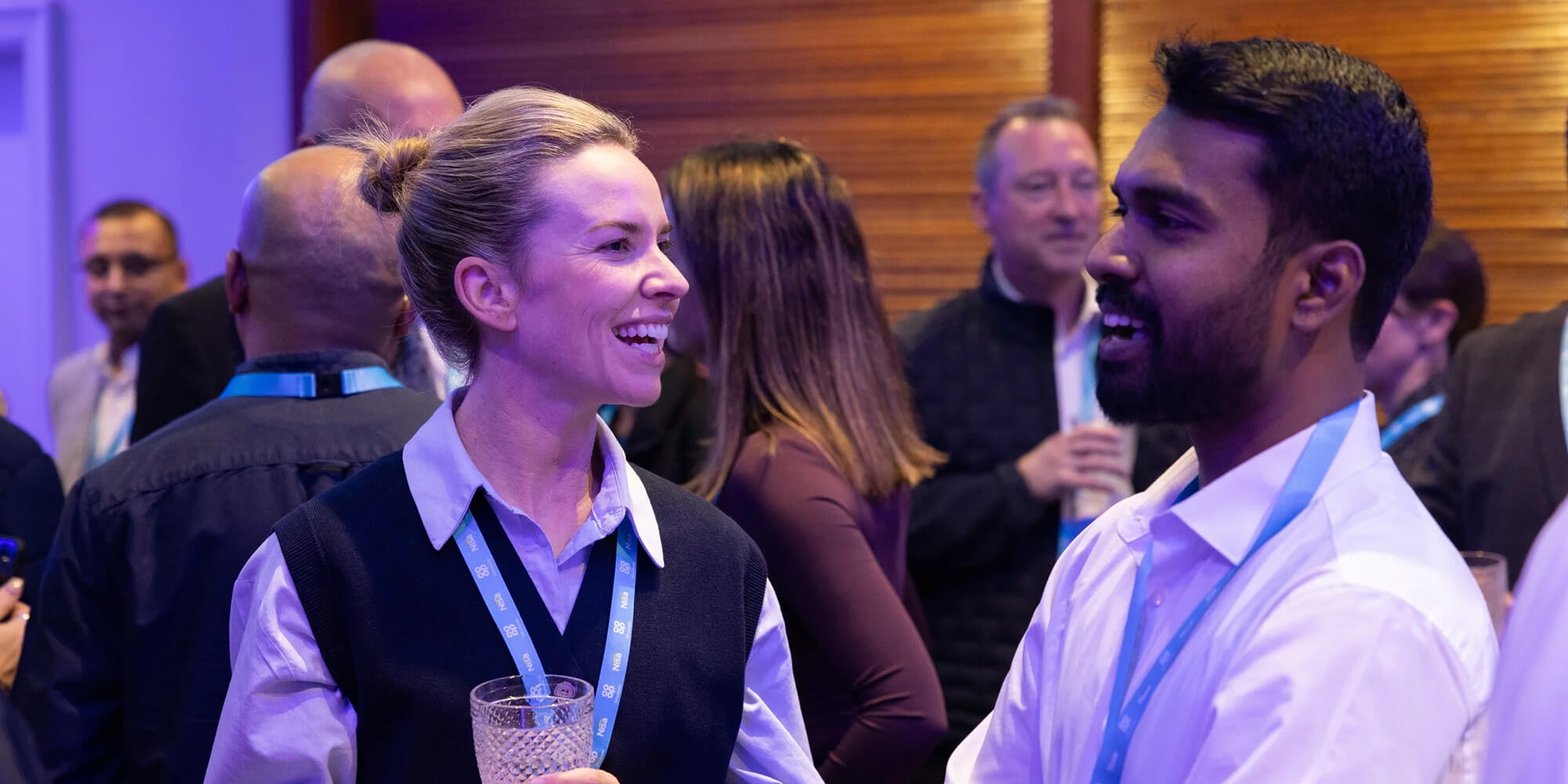 Attendees laughing together