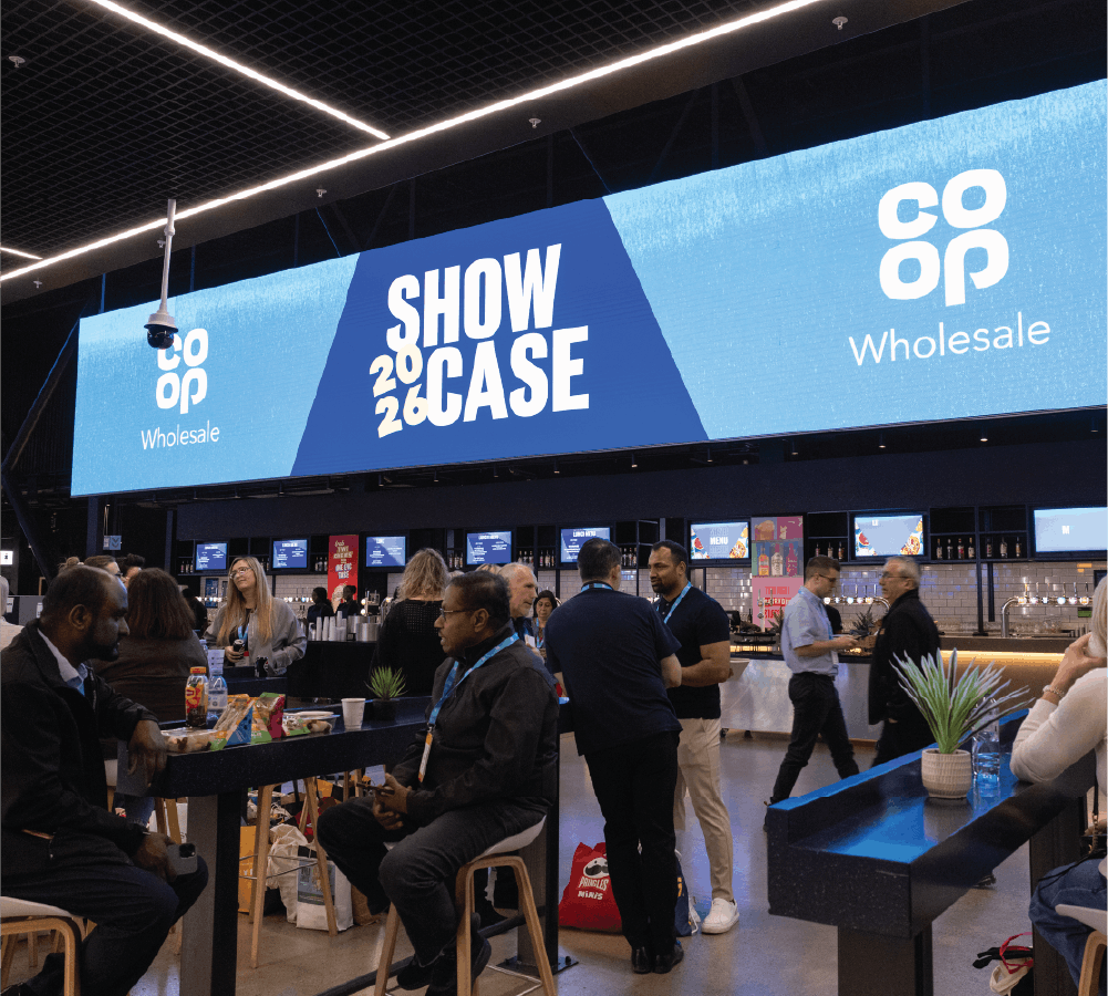 Co-op Wholesale Showcase exhibition screen with attendees