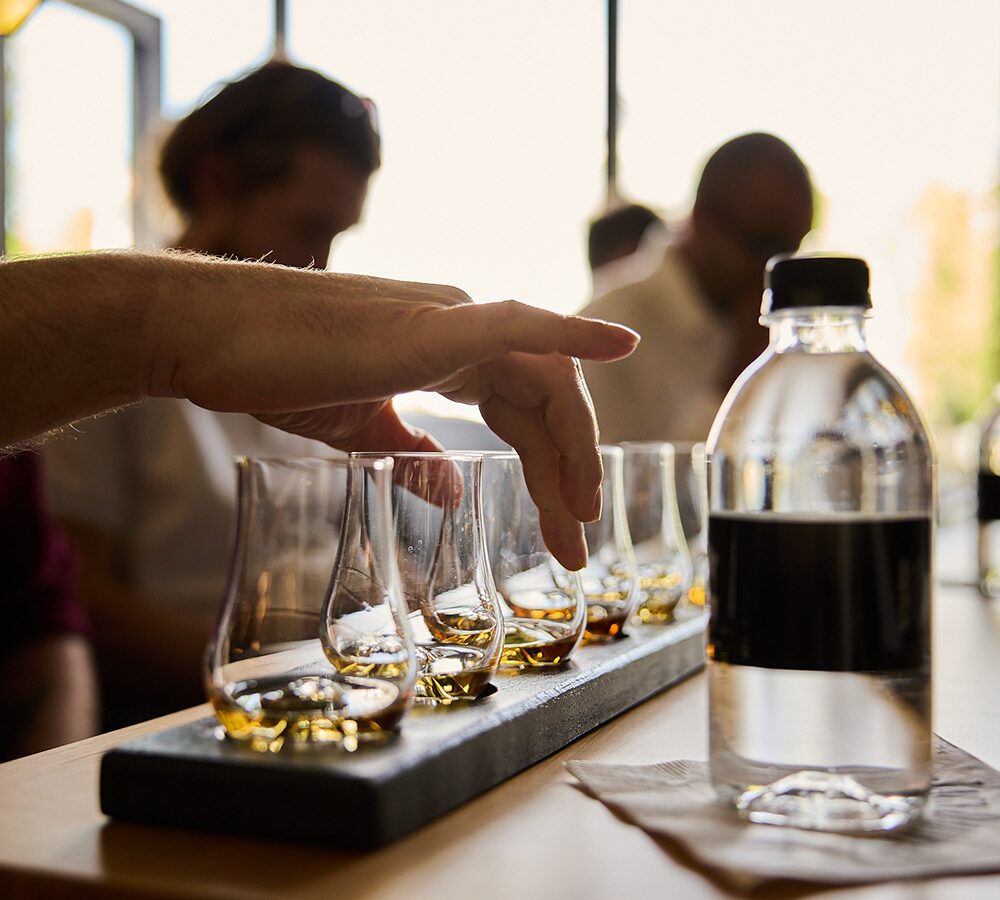 Whiskey tasting glasses and bottle