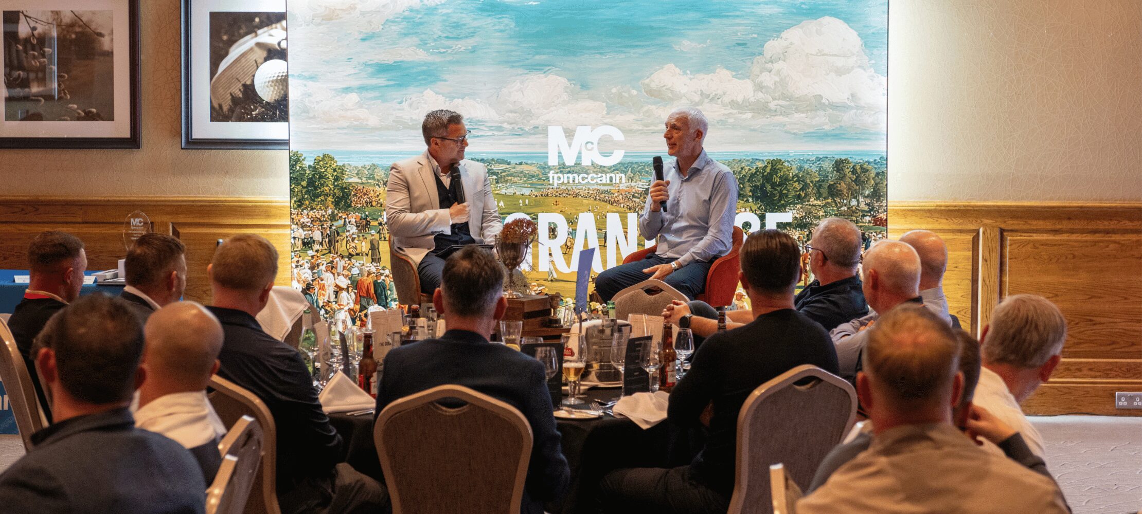 Speaker presentation during a corporate golf day dinner and networking event.