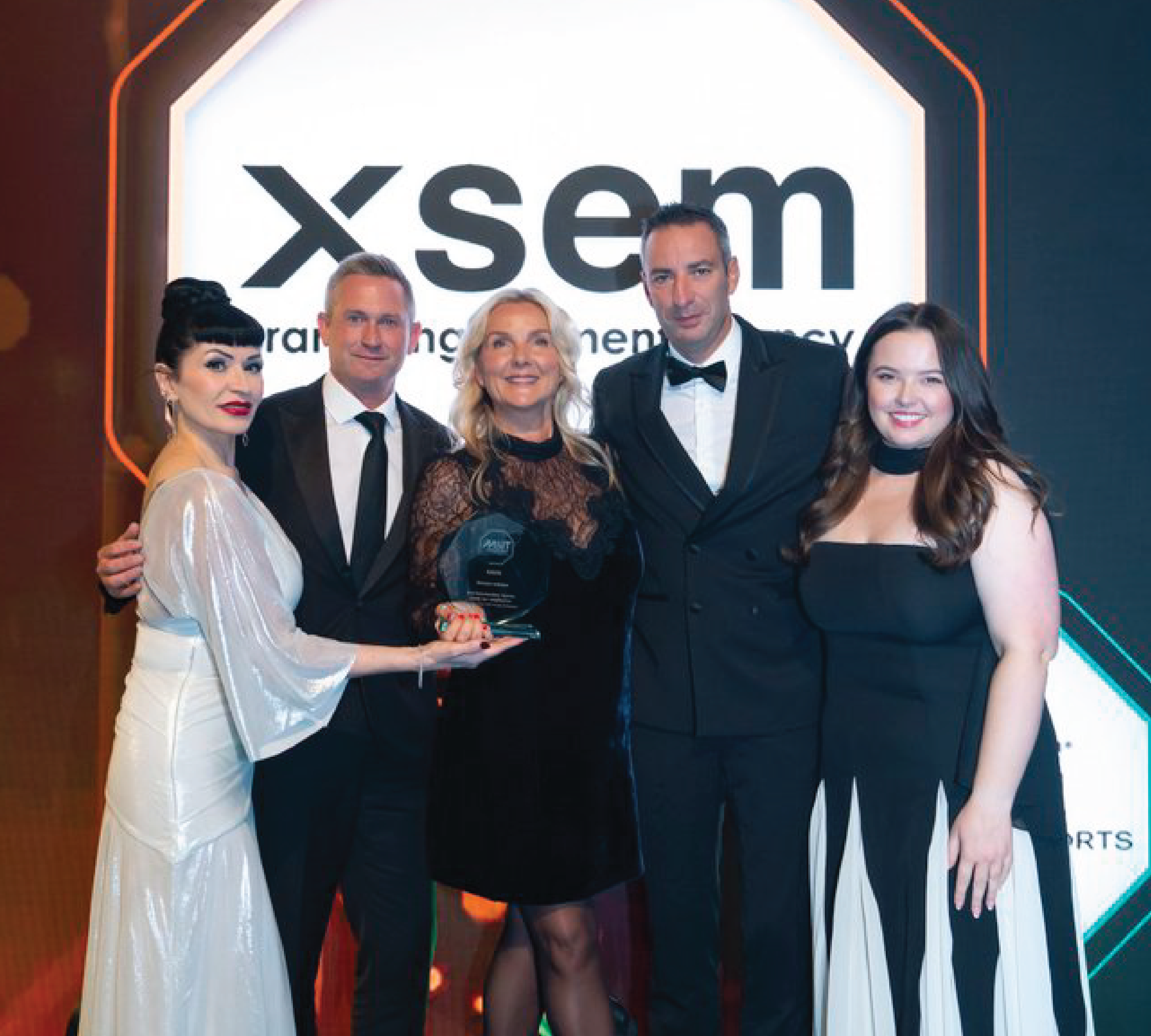 XSEM team on stage to collect their award